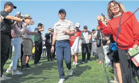  ??  ?? Rory McIlroy was a big hit with supporters in Shanghai (see right).