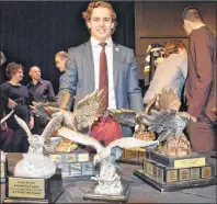  ?? CAPE BRETON POST PHOTO ?? Phélix Martineau poses with the five trophies he won during the Cape Breton Screaming Eagles award banquet at the Membertou Trade and Convention Centre on Monday. The Screaming Eagles captain took home the awards for leading scorer, top academic...