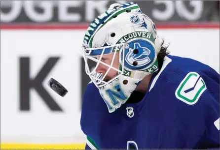  ?? The Canadian Press ?? Vancouver Canucks goalie Thatcher Demko watches the puck after making a save against the Winnipeg Jets in Vancouver on March 22.