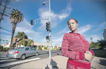  ?? Allen J. Schaben Los Angeles Times ?? PRECIOUS McLAUGHLIN, 24, a warehouse worker, often sees unmarked police SUVs, which are typically driven by Metro, cruising near her house on Arlington Avenue near West 48th Street in South L.A.