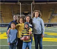  ?? ?? The Thompson family gathers for a portrait at Memorial Stadium in Berkeley.