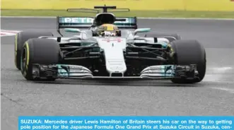  ?? — AP ?? SUZUKA: Mercedes driver Lewis Hamilton of Britain steers his car on the way to getting pole position for the Japanese Formula One Grand Prix at Suzuka Circuit in Suzuka, central Japan, yesterday.
