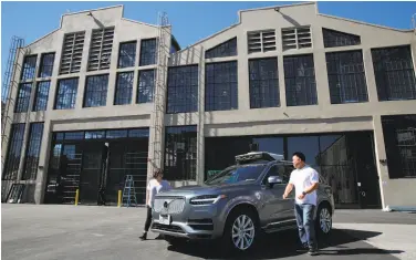  ?? Santiago Mejia / The Chronicle ?? Michelle Ortega (left) and Robert Phung will be among the Uber employees eligible for robot taxi rides.