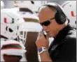  ?? GERRY BROOME — THE ASSOCIATED PRESS ?? Miami head coach Mark Richt speaks into his headset during a game against North Carolina in Chapel Hill, N.C.