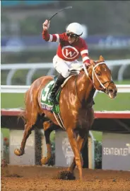  ?? Denis Poroy / Associated Press ?? Jockey Florent Geroux celebrates after riding Gun Runner to victory in the Breeders’ Cup Classic.