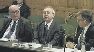  ??  ?? Professor david bell is flanked by ronald macdonald, left, and dr angus armstrong while giving evidence to the scottish affairs select committee at westminste­r yesterday