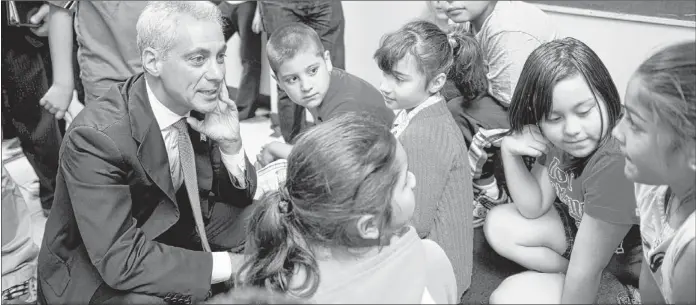  ??  ?? Mayor Rahm Emanuel visits students at Marantha Church on West 59th St., a “safe haven” site, on Monday, the first day of the teachers strike. | RICH HEIN~SUN-TIMES