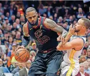  ?? [AP PHOTO] ?? Cleveland Cavaliers forward LeBron James looks to move past Golden State Warriors guard Stephen Curry during the first half in Game 3 of the NBA Finals on June 6 in Cleveland.