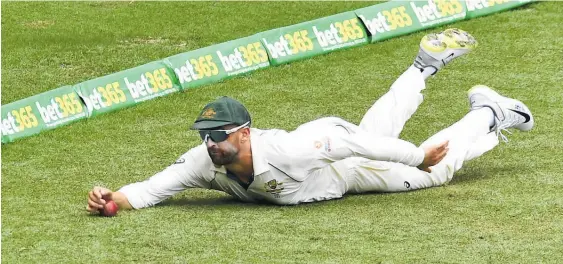  ?? Photo / Getty Images ?? Nathan Lyon dives to save an Indian boundary at the Gabba in Brisbane yesterday.