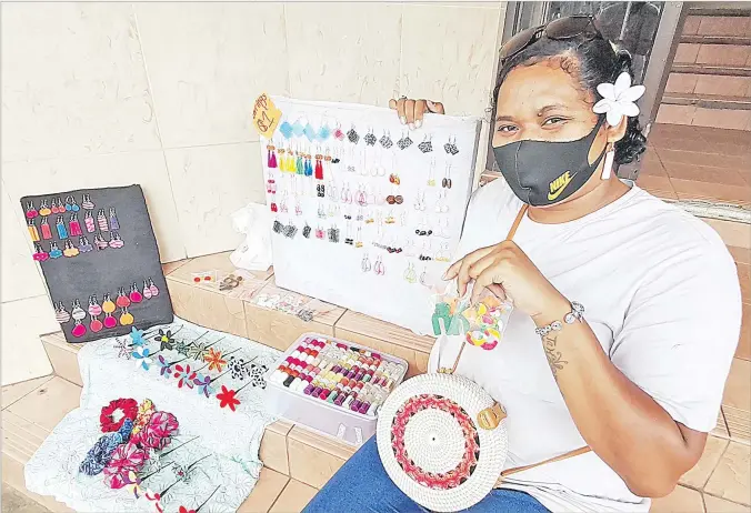  ?? Picture: SOPHIE RALULU ?? Fane Veiqaravi shows some of her products she sells in Suva.