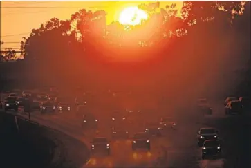  ?? Luis Sinco Los Angeles Times ?? TRAFFIC ON the 405 Freeway in Long Beach. Funding for the state’s road and bridge repairs has been affected since March 2020 by the pandemic, as fewer people were driving and therefore buying less gas.