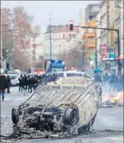  ?? AFP ?? ■ A car burns outside the Lycee Profession­nel Jean-Pierre Timbaud high school after being set ablaze by protesters on Monday.