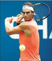  ?? Julian Finney Getty Images ?? RAFAEL NADAL of Spain returns the ball during his match against Nikoloz Basilashvi­li of Georgia.