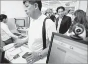  ?? Ricardo DeAratanha Los Angeles Times ?? FOR INSIKT, a bill would allow the company to offer larger loans through its nearly 400 “finder” locations. Above, a lender inside a Liborio Market in 2010.