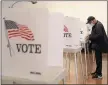  ?? ARIC CRABB — STAFF ARCHIVES ?? A voter fills out his ballot at a San Jose voting site in 2020. The state of Alaska is in the process of changing its voting system to a new version of rankedchoi­ce voting.