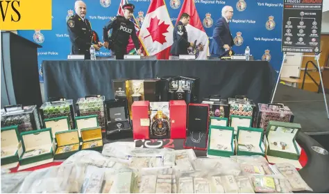  ?? PETER J THOMPSON/NATIONAL POST ?? York Regional Police and Canadian government officials in Aurora stand behind some of the items confiscate­d on Thursday.
Fifteen people have been arrested, including nine directly linked to the ‘Ndrangheta crime family.