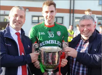  ??  ?? Ronan Grufferty receives the Christy Bellew Cup from Des Halpenny, county chairman and Peter Kierans, Anglo Printers.