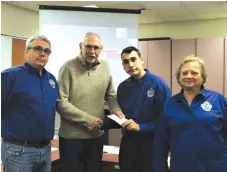  ??  ?? L-R: Local ACT/UCT president Mark Gilliland, Crime Stoppers president Lyle Johnson, ACT/UCT youth representa­tive Sebasten Halvorsen, and ACT/ UCT representa­tive Pat Carle presenting a donation to Crime Stoppers.