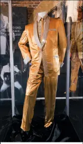  ?? ?? The many Elvis artefacts on display include one of the iconic gold lamé suits worn by the King in the 50s