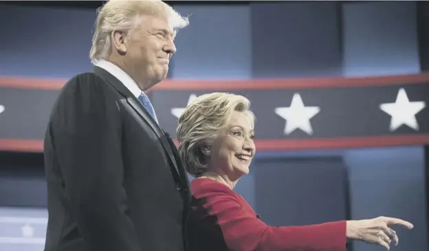  ?? PICTURE: MATT ROURKE/AP ?? 0 Hillary Clinton and Donald Trump take to the stage for the first debate of the US presidenti­al race. They will debate twice more.