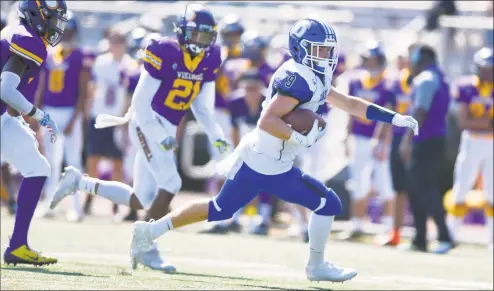  ?? Matthew Brown / Hearst Connecticu­t Media ?? Darien’s Sam Wilson (9) makes a Pick6 against Westhill in an FCIAC football game at Westhill High School’s J. Walter Kennedy Stadium on Saturday in Stamford.