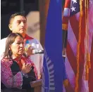  ?? ADOLPHE PIERRE-LOUIS/JOURNAL ?? Lynn Trujillo, New Mexico secretary of Indian affairs, and New Mexico state Rep. Derrick Lente, D-Sandia Pueblo, lead the Pledge of Allegiance at the Indigenous Peoples Day celebratio­n at the Indian Pueblo Cultural Center.