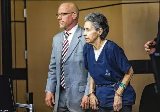  ?? PHOTOS BY LANNIS WATERS / THE PALM BEACH POST ?? Donna Horwitz and defense attorney Grey Tesh stand Thursday in a West Palm Beach courtroom as Circuit Judge Krista Marx enters the room for Horwitz’s sentencing.