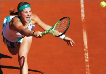  ?? THE ASSOCIATED PRESS ?? Latvia’s Jelena Ostapenko plays a shot against Timea Bacsinszky of Switzerlan­d during their semifinal Thursday at the French Open. Osapenks won 7-6(4), 3-6, 6-3 and faces Simona Halep for the title.