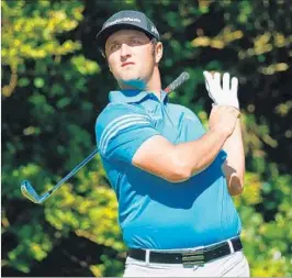  ?? GREGORY SHAMUS/GETTY ?? Jon Rahm tees off at Royal Birkdale during the first round of the British Open on Thursday.