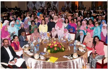  ?? — Bernama ?? Working together for progress: Dr Wan Azizah sharing a moment with guests after her speech at the Internatio­nal Convention Centre in Putrajaya.