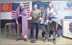  ?? HERALD photo/Amanda Duforat ?? Following the recent Veterans of Comedy fundraiser comedy show, two of the performers were presented with a Quilt of Valor. Michael Shields (right) and Chris Crawford (left) were presented with the quilts by Veteran Mike Tarpley (center).