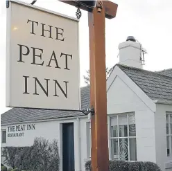  ??  ?? Serving up success: Andrew Fairlie, at work in his restaurant at Gleneagles Hotel, and the Peat Inn have both been highly praised in the latest Good Food Guide.