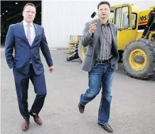  ?? LEAH HENNEL ?? Economic Developmen­t Minister Deron Bilous, left, tours Glenmore Fabricator­s on Thursday with GM Jason Gillen. Bilous talked about a new tax credit for businesses, and discussed Northern Gateway.