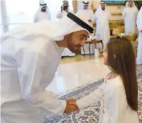  ?? Wam file ?? His Highness Sheikh Mohamed bin Zayed Al Nahyan, Crown Prince of Abu Dhabi and Deputy Supreme Commander of the UAE Armed Forces, greets Rouda, daughter of a martyr. —