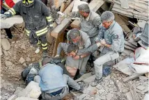  ?? PHOTO: REUTERS ?? A man is rescued alive from the ruins of a building following an earthquake in Amatrice, central Italy.