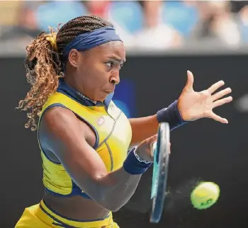  ?? Kelly Defina/getty Images ?? Coco Gauff plays a forehand in a third-round match against Alycia Parks during the Australian Open at Melbourne Park on Friday.