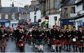  ??  ?? On parade Pipe bands during the procession to the Wellmeadow