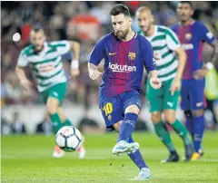  ?? AP ?? Barcelona’s Lionel Messi scores a penalty against Eibar.