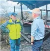  ?? ?? Fire investigat­or Shayne Andrews with Premier Jeremy Rockliff.