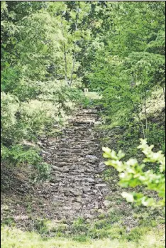  ?? FRANZ PHOTOGRAPH­Y VIA THE NEW YORK TIMES ?? The remnants of a staircase where a famous scene from “Dirty Dancing” was filmed, near Lake Lure in North Carolina. Then a boys camp, the site is now occupied by private homes.