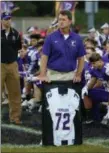  ?? KYLE SOOY — THE MORNING JOURNAL ?? Vermilion coach Brett Colahan presents the family of late coach Matt Kobal with a jersey in his honor prior to the Sailors’ game against Firelands on Sept. 7.