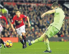  ??  ?? James Milner makes no mistake from the spot to put Liverpool ahead.