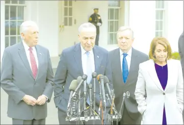  ??  ?? Pelosi, Schumer, House Majority Leader Steny Hoyer (D-MD) and Sen. Dick Durbin (D-IL) speak to the media after meeting with Trump about ending the partial government shutdown in Washington, DC. — AFP photo