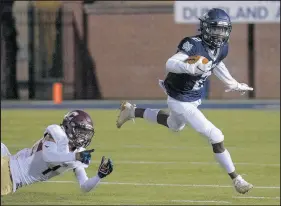  ?? MICHAEL GARD/POST-TRIBUNE ?? Michigan City’s Kaydarious Jones, right, who had 41 catches for 491 yards and five touchdowns last season, eludes Chesterton’s Mike Williams Jr.