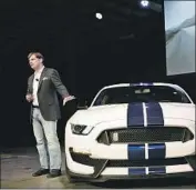  ?? Al Seib Los Angeles Times ?? JIM FARLEY, then a marketing executive, shows off the new Shelby GT350 Mustang in Gardena in 2014.