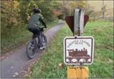  ?? KAREN TESTA — THE ASSOCIATED PRESS ?? Zack Wong, 14, of Wynnewood, Pa., riding along the Virginia Creeper Trail near Damascus, Va. The trail stretches nearly 34 miles between Whitetop Station, Va., near the North Carolina border, and Abingdon, Va. The trail — especially the 17 miles from...