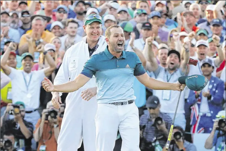  ?? CURTIS COMPTON / CCOMPTON@AJC.COM ?? Sergio Garcia screams with joy Sunday as he wins the Masters — his first major victory — by sinking a birdie putt on the first playoff hole against Justin Rose at Augusta National Golf Club.