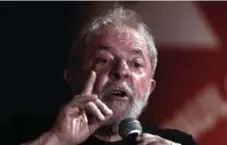  ?? MIGUEL SCHINCARIO­L/AFP/GETTY IMAGES ?? An appellate court in Brazil is weighing whether to uphold or dismiss a corruption conviction against former president Luiz Inacio Lula Da Silva.