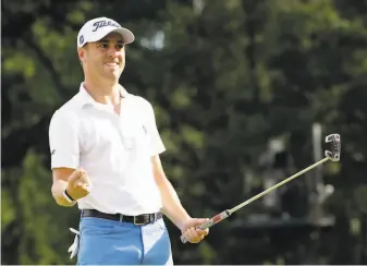  ?? Nam Y. Huh / Associated Press ?? Justin Thomas celebrates after his birdie putt on No. 18 clinched his win in the BMW Championsh­ip at Medinah (Ill.) Country Club. He’s the No. 1 seed in the FedEx Cup finale.