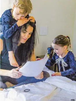  ?? ESTHER HERNANDEZ PHOTOS ?? Kelly Williams often finds herself working in various areas of her home. “My kids often dictate my space, and I wouldn’t have it any other way,” she says.